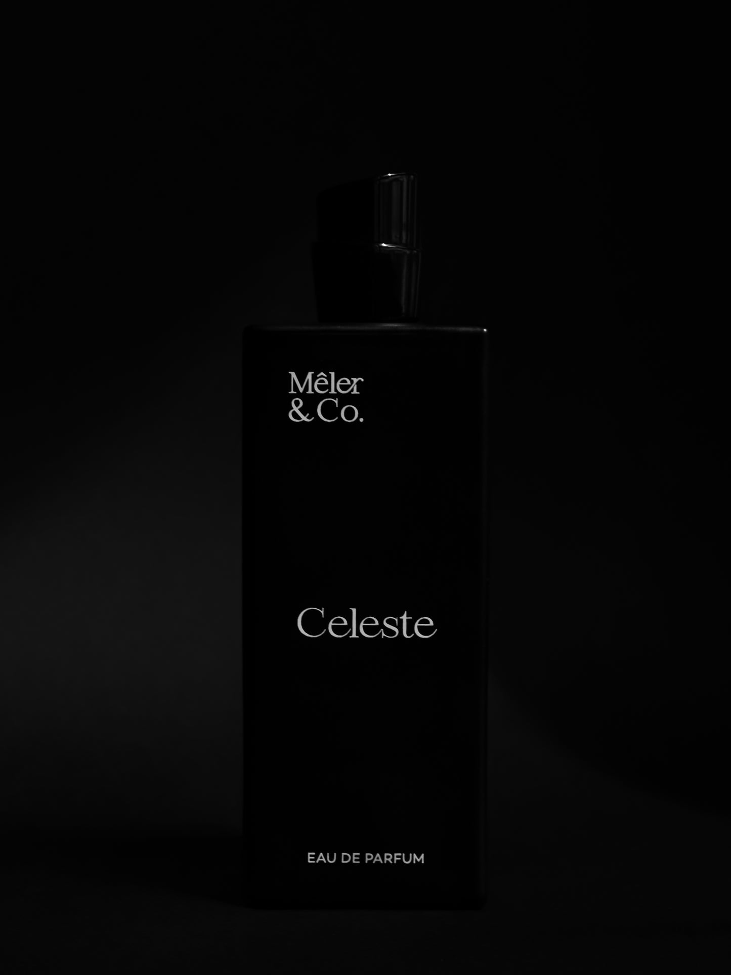 Mêler & Co. Celeste eau de parfum bottle on matte black background