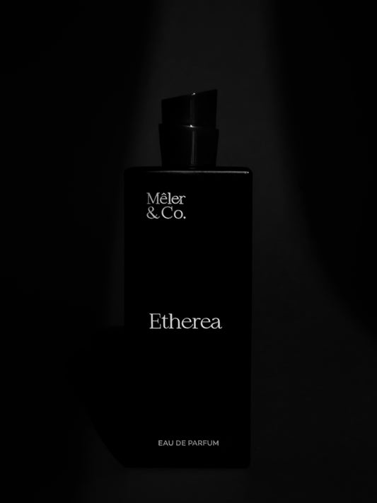 Mêler & Co. Etherea eau de parfum bottle on matte black background